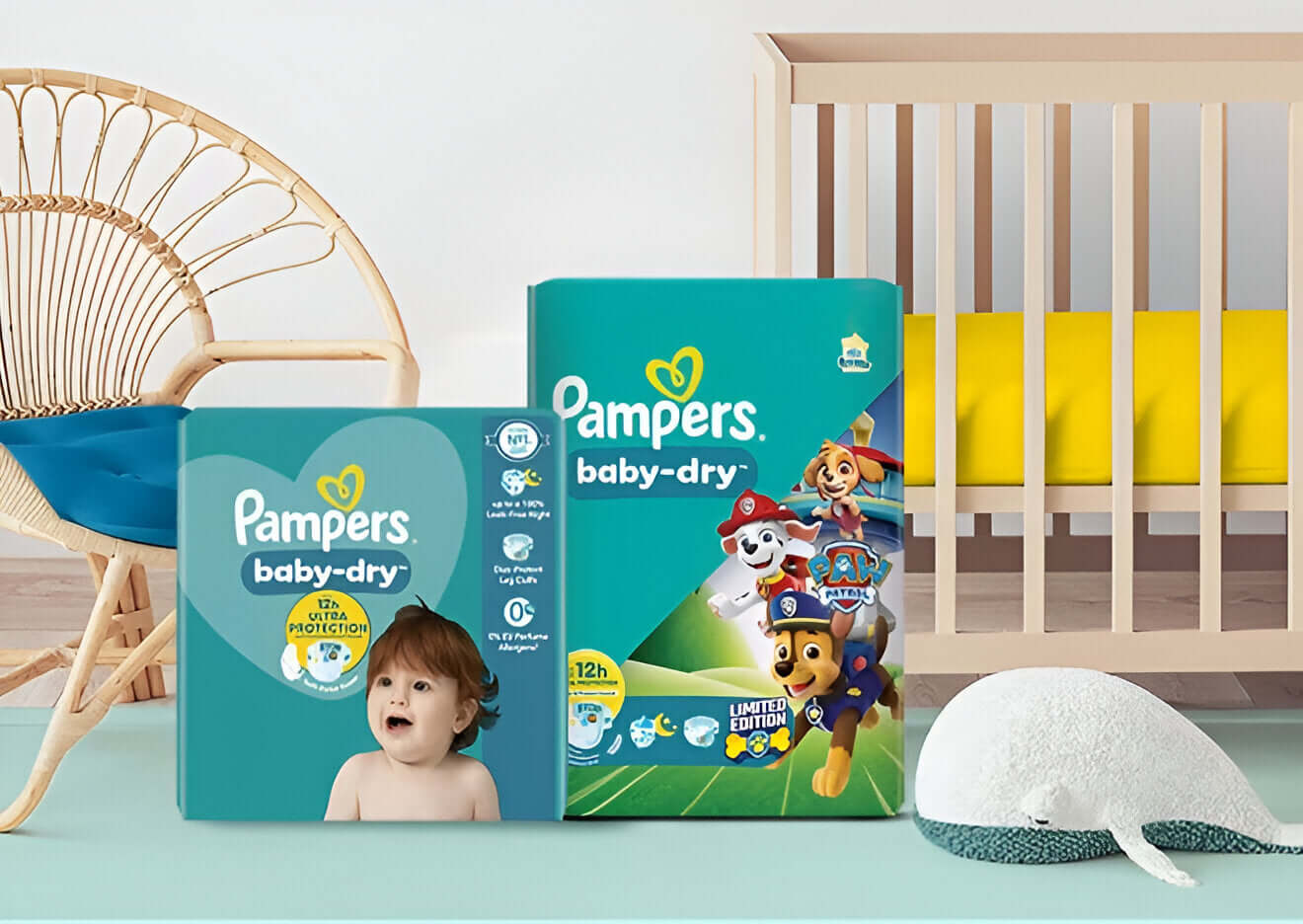Pampers baby-dry diapers packaging with Paw Patrol characters in a nursery setting.