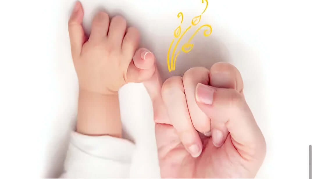 Close-up of adult and child hands holding each other with a decorative element on a white background